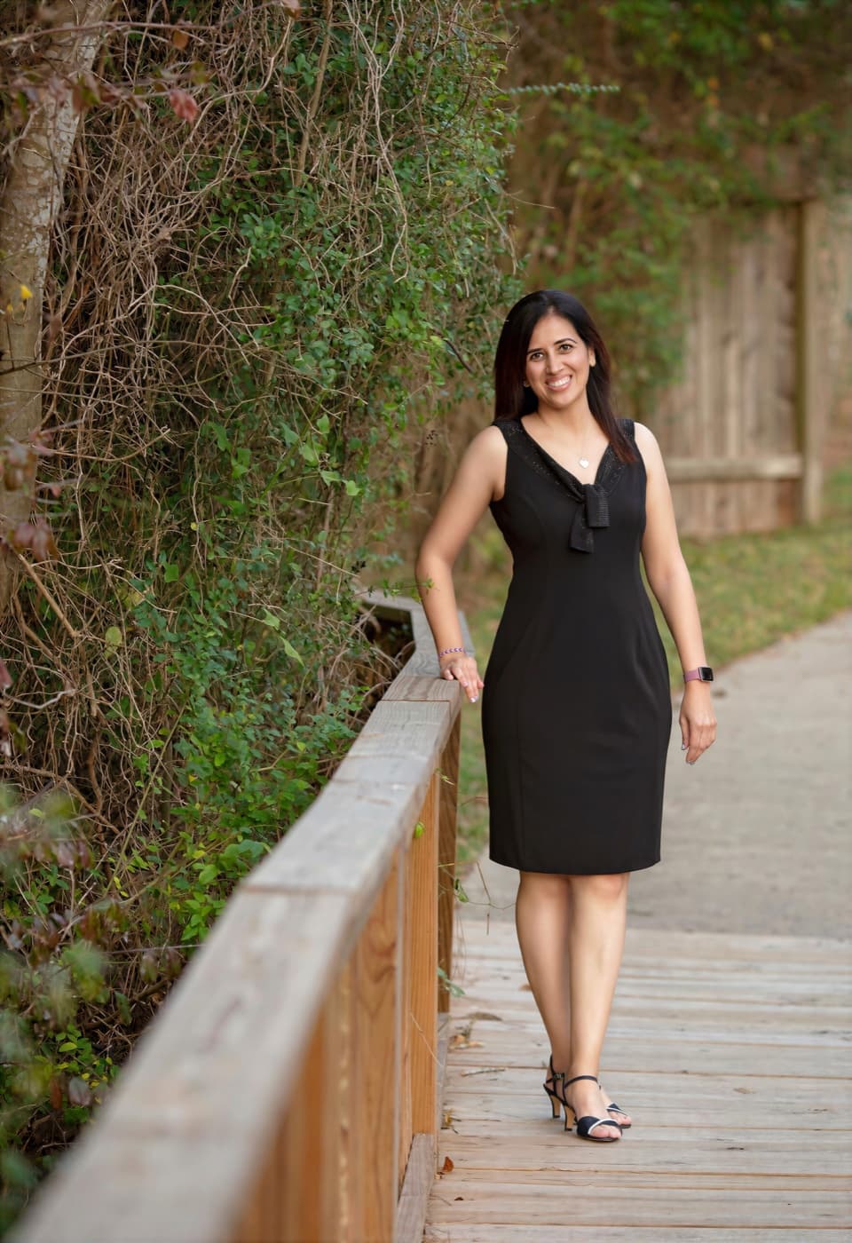 Sweta Dassani, photographed outdoors on a wooden walkway